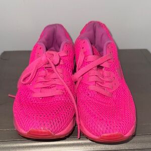 Vibrant Pink Nike sneakers for women
